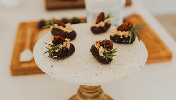 Goat cheese stuffed Medjool dates with rosemary pecans and maple syrup