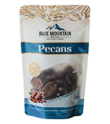 Packaging of Blue Mountain Pecans with pecans and chocolate on a white background