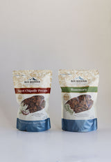 Two packages of Blue Mountain snacks Sweet Chipotle and Rosemary